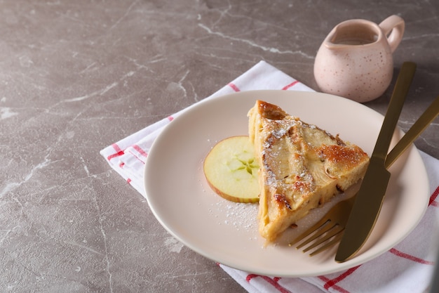 Concept of tasty food with apple pie on textured background