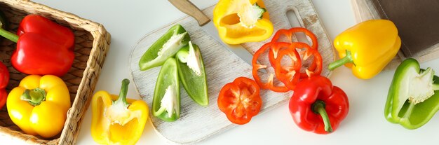 Concept of tasty food with bell pepper on white background