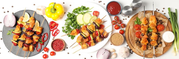 Concept of tasty food with chicken shashlik on white background