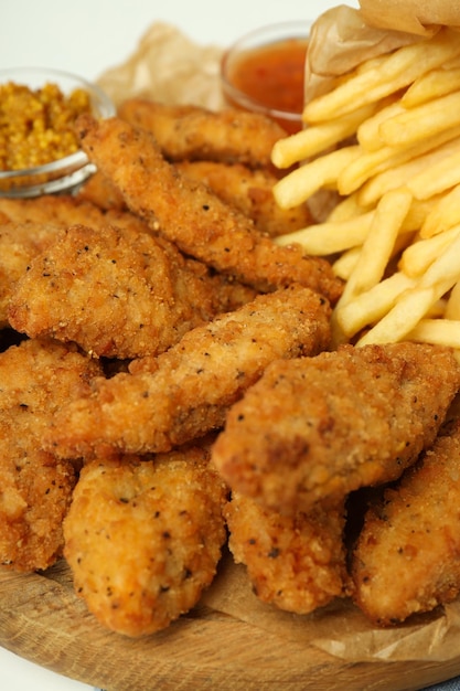 Concept of tasty food with chicken strips close up
