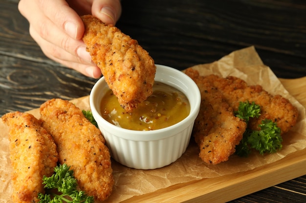 Concept of tasty food with chicken strips close up