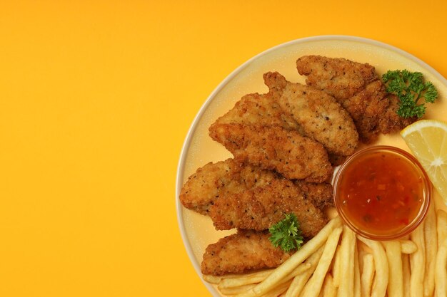 Concept of tasty food with chicken strips space for text