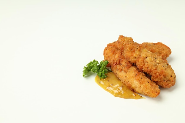 Concept of tasty food with chicken strips space for text