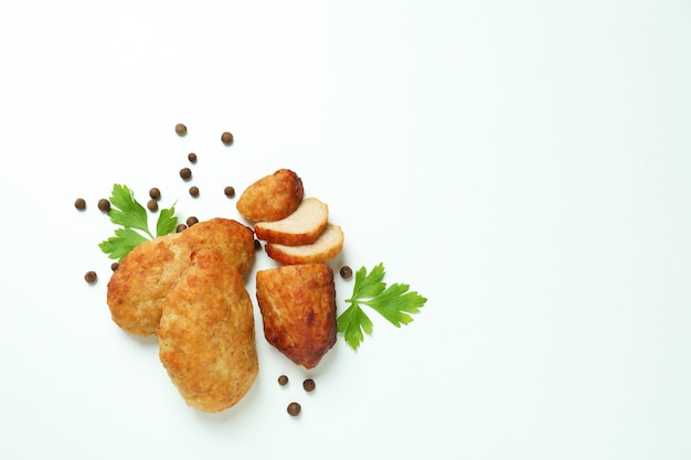 Concept of tasty food with cutlets on white background