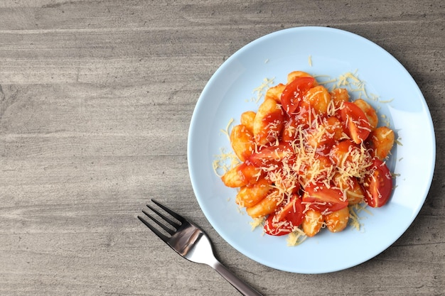 Foto concetto di cibo gustoso con spazio per gli gnocchi per il testo