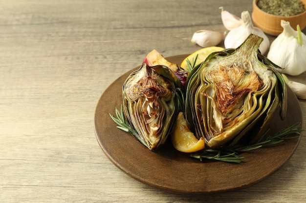 Concept of tasty food with grilled artichoke space for text