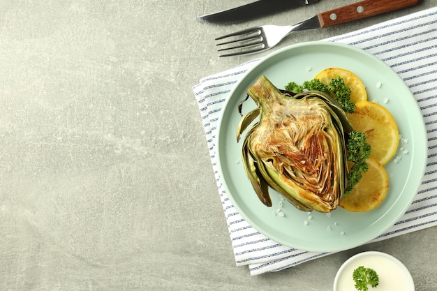 Concept of tasty food with grilled artichoke space for text