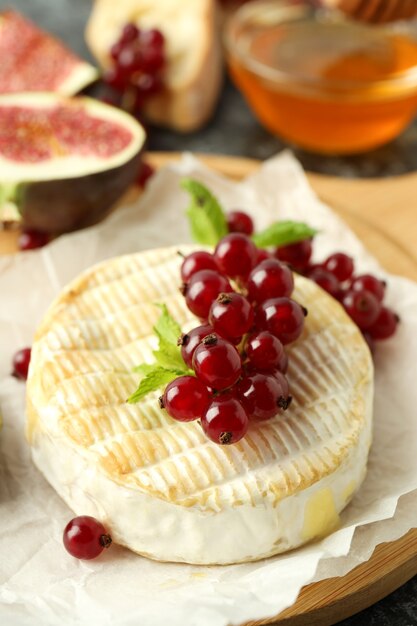 Concept of tasty food with grilled camembert, close up.