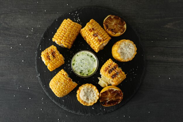 Concept of tasty food with grilled corn