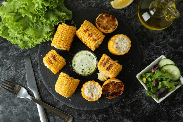 Concept of tasty food with grilled corn