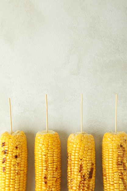 Photo concept of tasty food with grilled corn