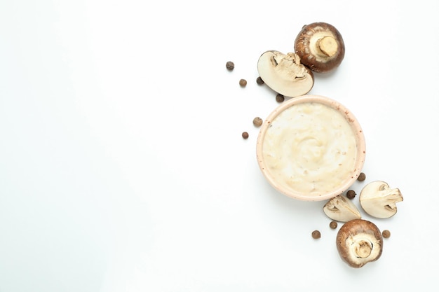 Concept of tasty food with mushroom sauce on white background