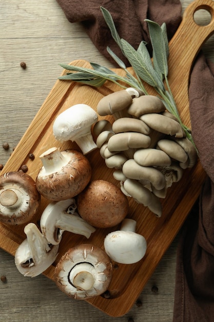 Concept of tasty food with mushrooms on wooden background