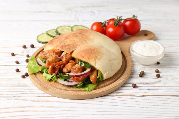 Concept of tasty food with pita with chicken meat