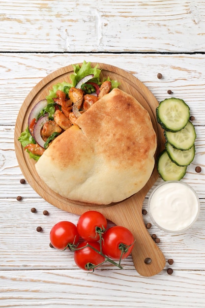 Concept of tasty food with pita with chicken top view