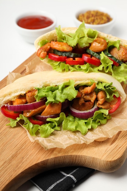 Concept of tasty food with pitas with chicken close up