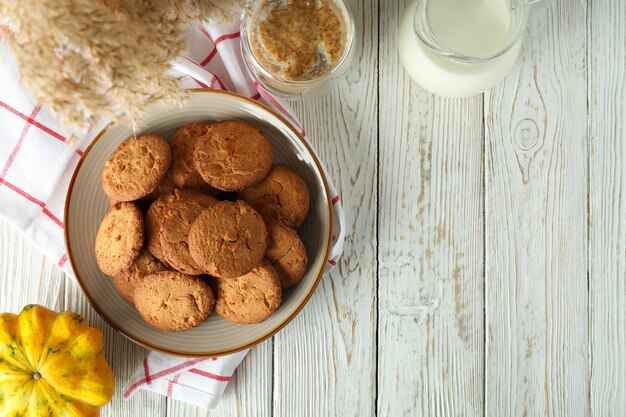 Concept of tasty food with pumpkin cookies, space for text.