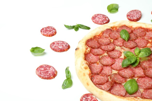 Photo concept of tasty food with salami pizza on white background