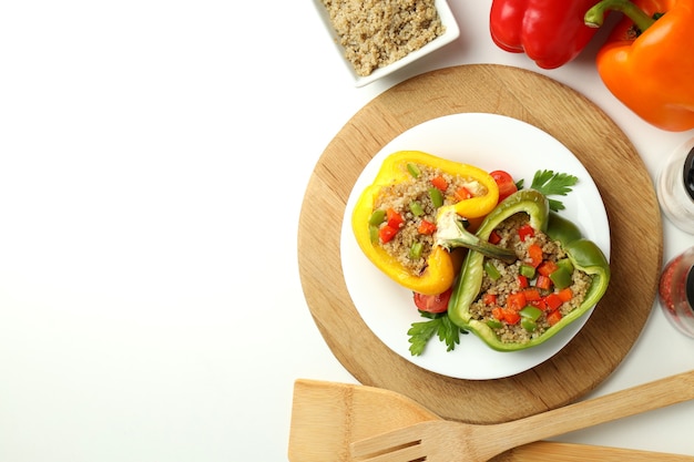 Concept of tasty food with stuffed pepper on white background