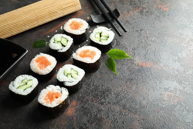 Concept of tasty food with sushi rolls, space for text