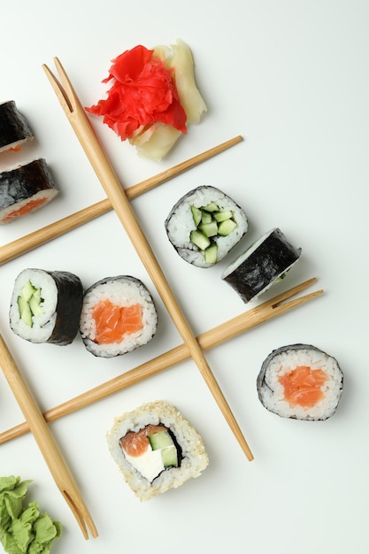 Concept of tasty food with sushi rolls on white background