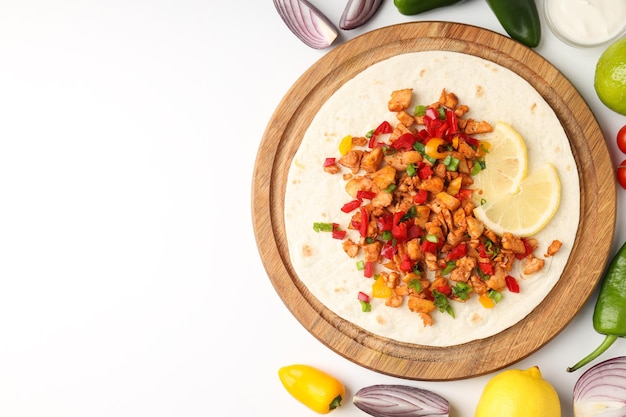 Concept of tasty food with taco on white background