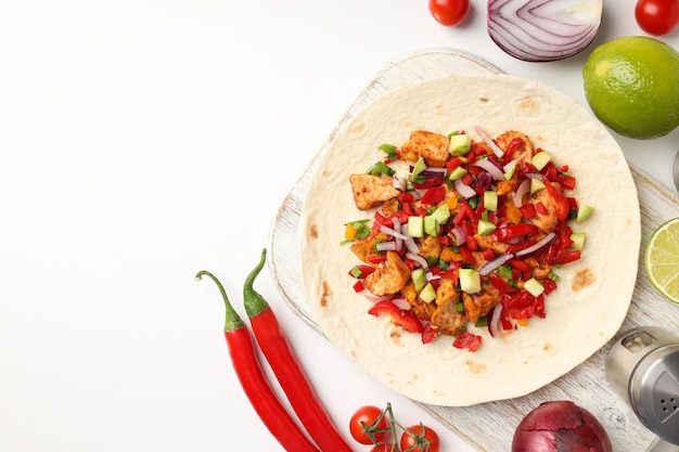 Concept of tasty food with taco on white background