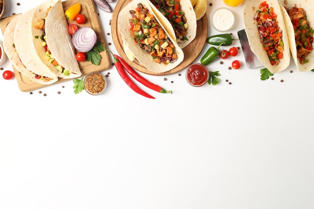 Concept of tasty food with taco on white background