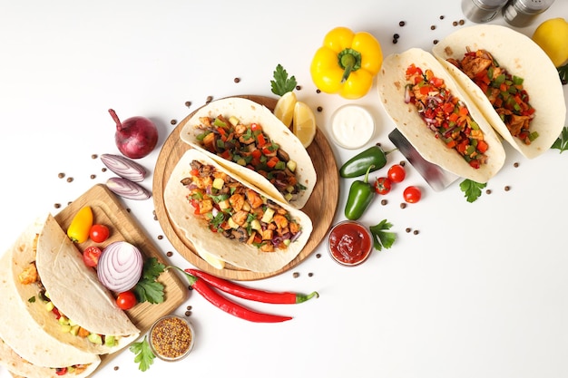 Concept of tasty food with taco on white background