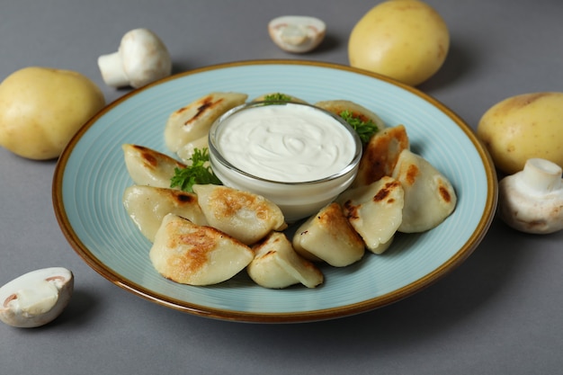 Concept of tasty food with vareniki or pierogi