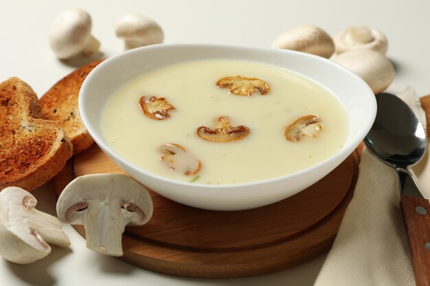 Concept of tasty lunch with bowl of mushroom soup