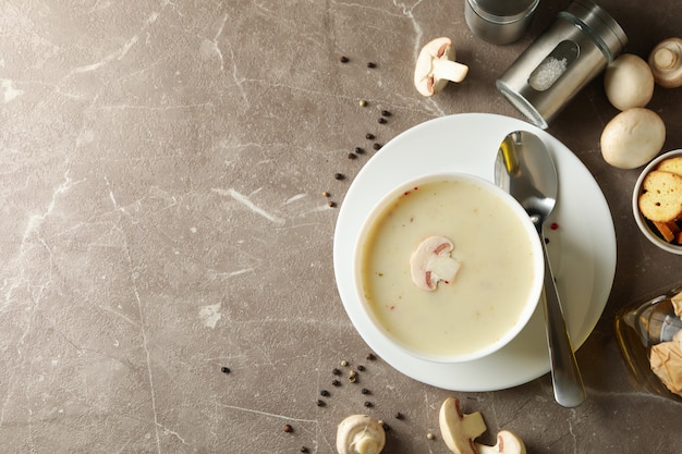 Concept of tasty lunch with bowl of mushroom soup