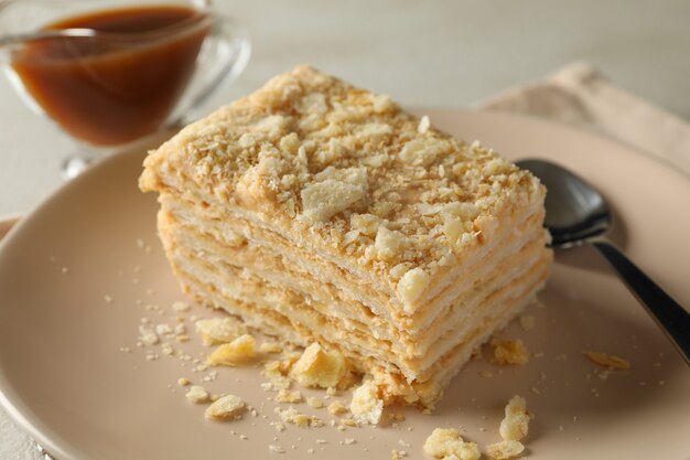 Photo concept of tasty lunch with plate of napoleon cake