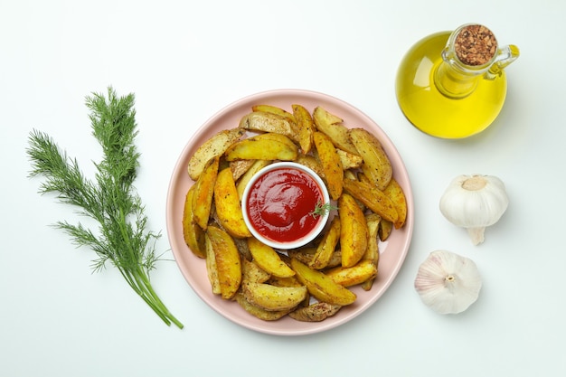 Concept of tasty meal with potato wedges on white background