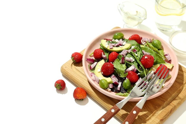 Concept of tasty salad salad with strawberry space for text