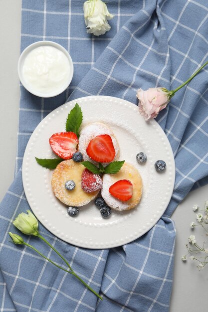 Concept of tasty sweet food, cheese pancakes, top view