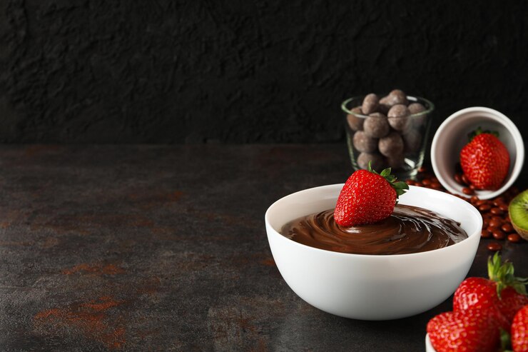 Photo おいしい甘い食べ物チョコレートフォンデュのコンセプト