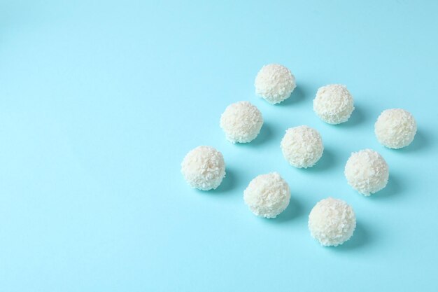 Concept of tasty sweets coconut candies space for text