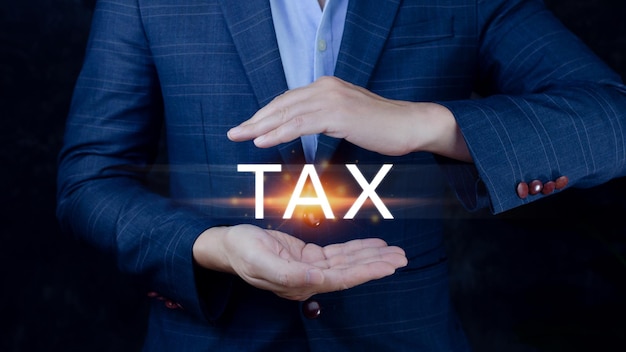 Concept of taxes payment optimisation business finance Businessman touching taxes icon income tax and property Tax Payment individuals and corporations such as VAT