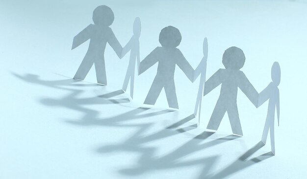 Concept of teamworkteam paper men standing