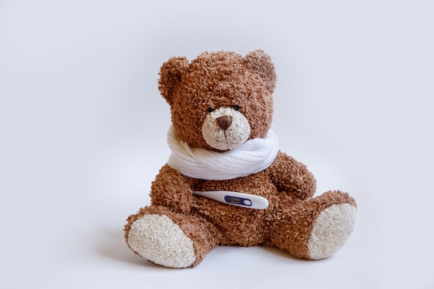 Concept teddy bear childhood diseases on white background