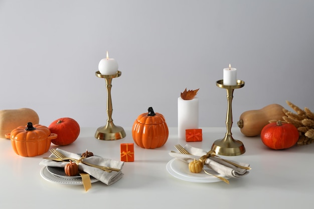 Concept of Thanksgiving day Autumn table setting on white table