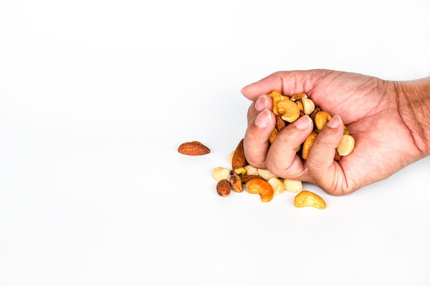 concept trail mix day handful men trail mix on white background closeup copy space on left for design or text