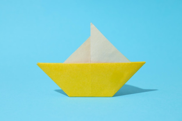 Photo concept of travel and adventure with paper boat