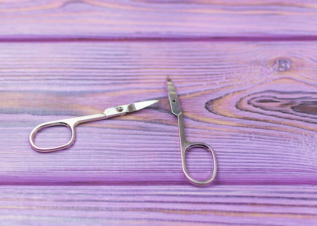The concept of an unsuccessful manicure Broken scissors