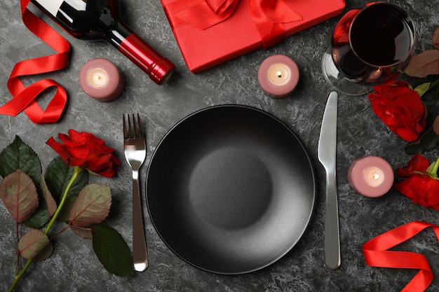 Concept of Valentine's day with different accessories on black smokey table