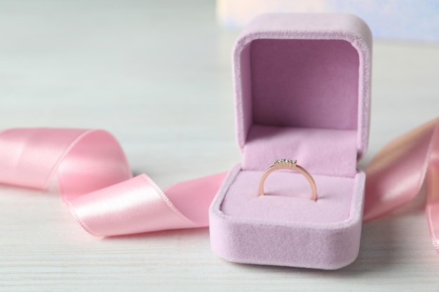 Concept of wedding accessories with wedding ring, close up