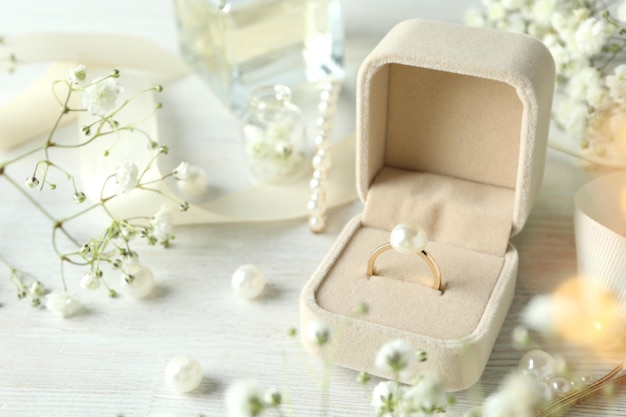 Concept of wedding accessories with wedding ring, close up