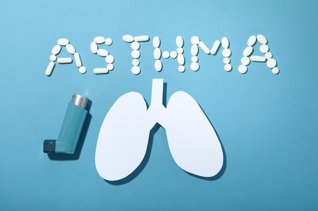 Concept of World Asthma Day on blue background