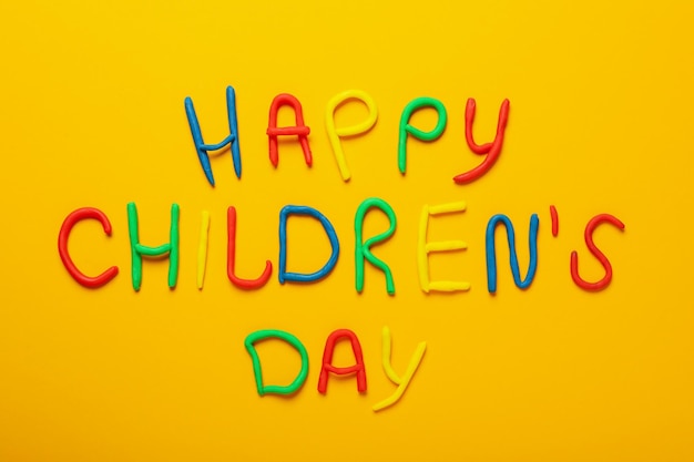 Concept of world children's day on orange background